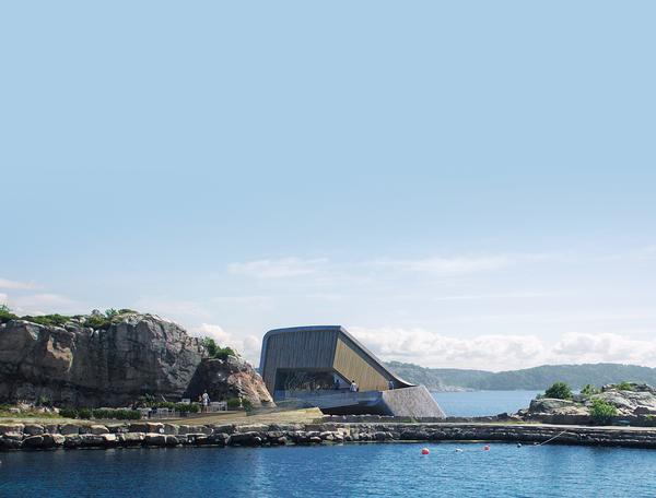 The concrete shell was cast in southern Norway. The building was constructed on a barge so that it could be lowered into the water