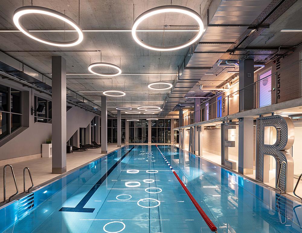 The building features a three storey gym with a pool. The 5m high lettering can be seen from inside and outside of the complex