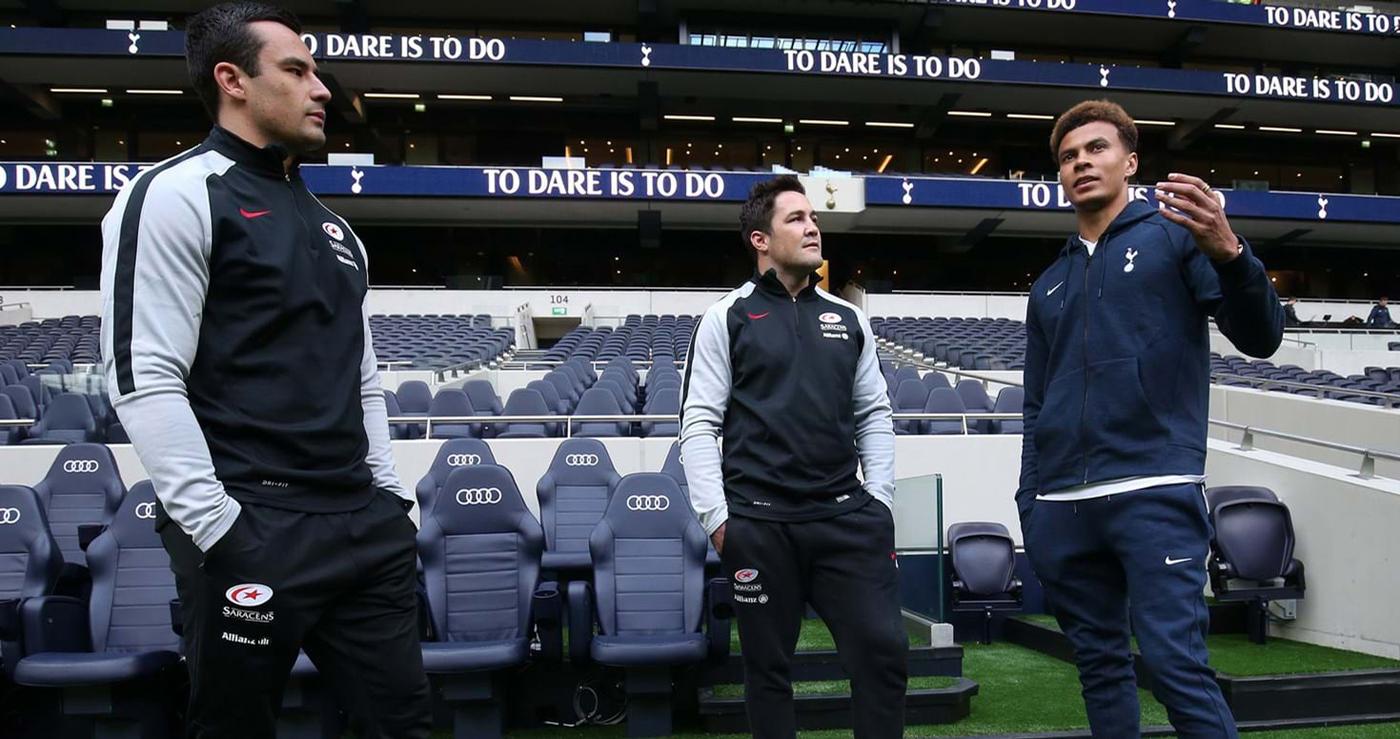 Tottenham star player Dele Alli (right) with Saracens player Brad Barritt (centre) at the new stadium / Tottenham Hotspur