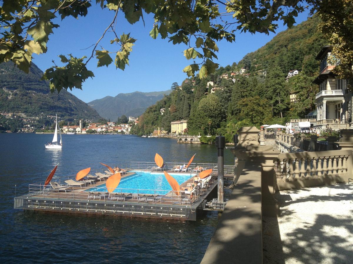 Extending out from the shoreline, the resort’s swimming pool and spacious sundeck float on the lake