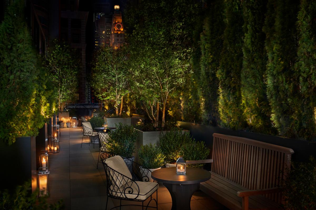 The Blade Runner Terrace comprises a number of trees and plants, benches, love seats, and tables. / Photo by Nicholas Koenig