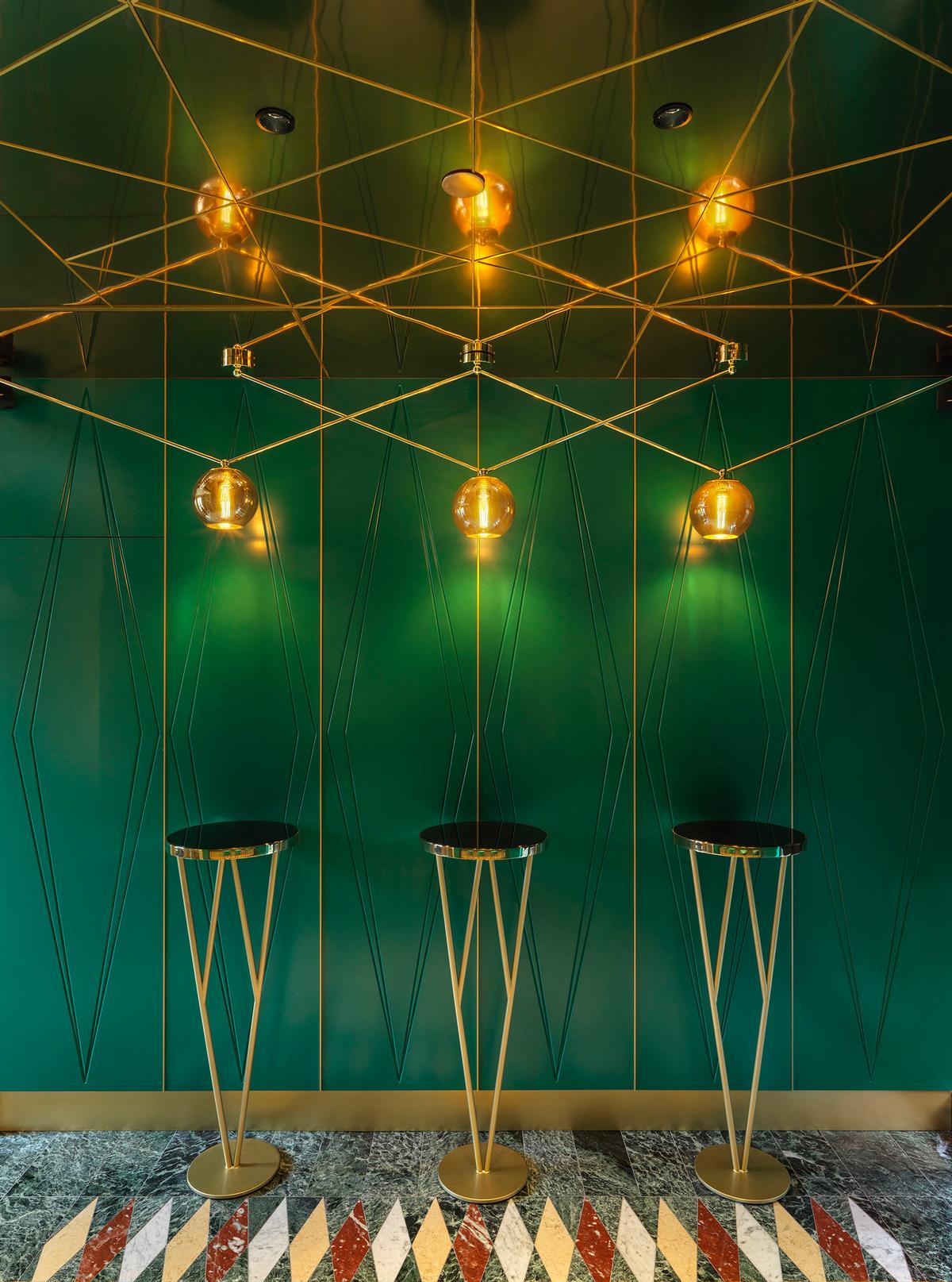 A green and gold theme is pulled through the restaurant / Matteo Piazza