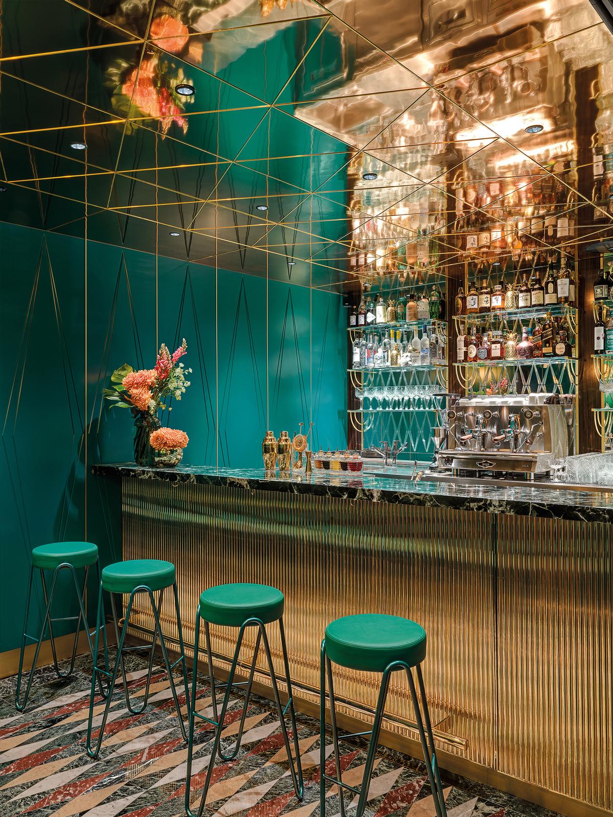 Polished brass and green Alpi marble are used for the bar counter / Matteo Piazza