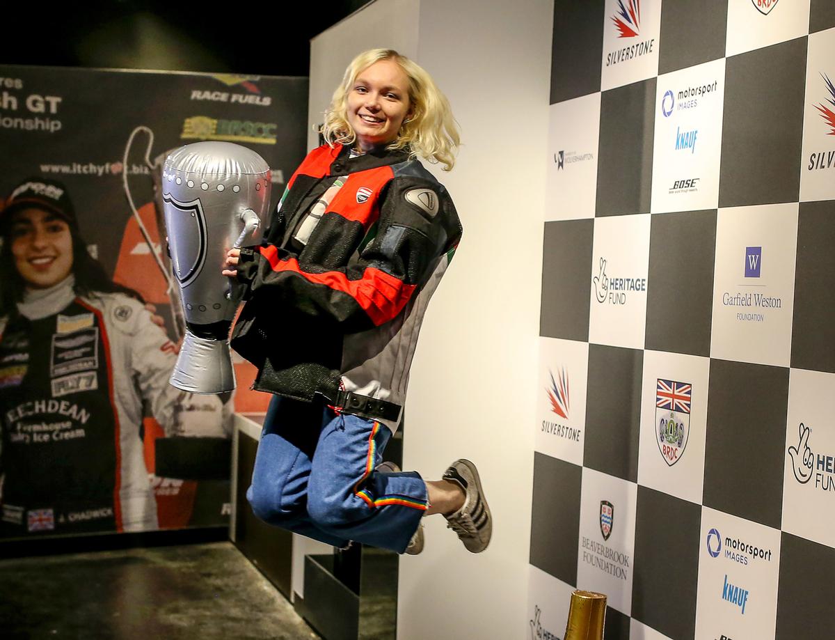 Lifting the trophy is just one of 20 interactive features at the new Silverstone Experience / The Silverstone Experience