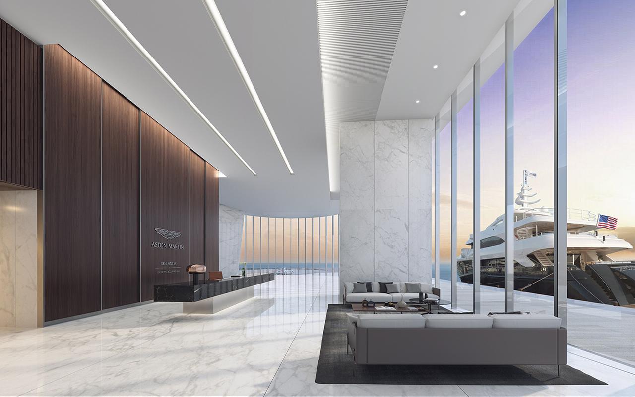 There are floor-to-ceiling windows in the lobby / Aston Martin