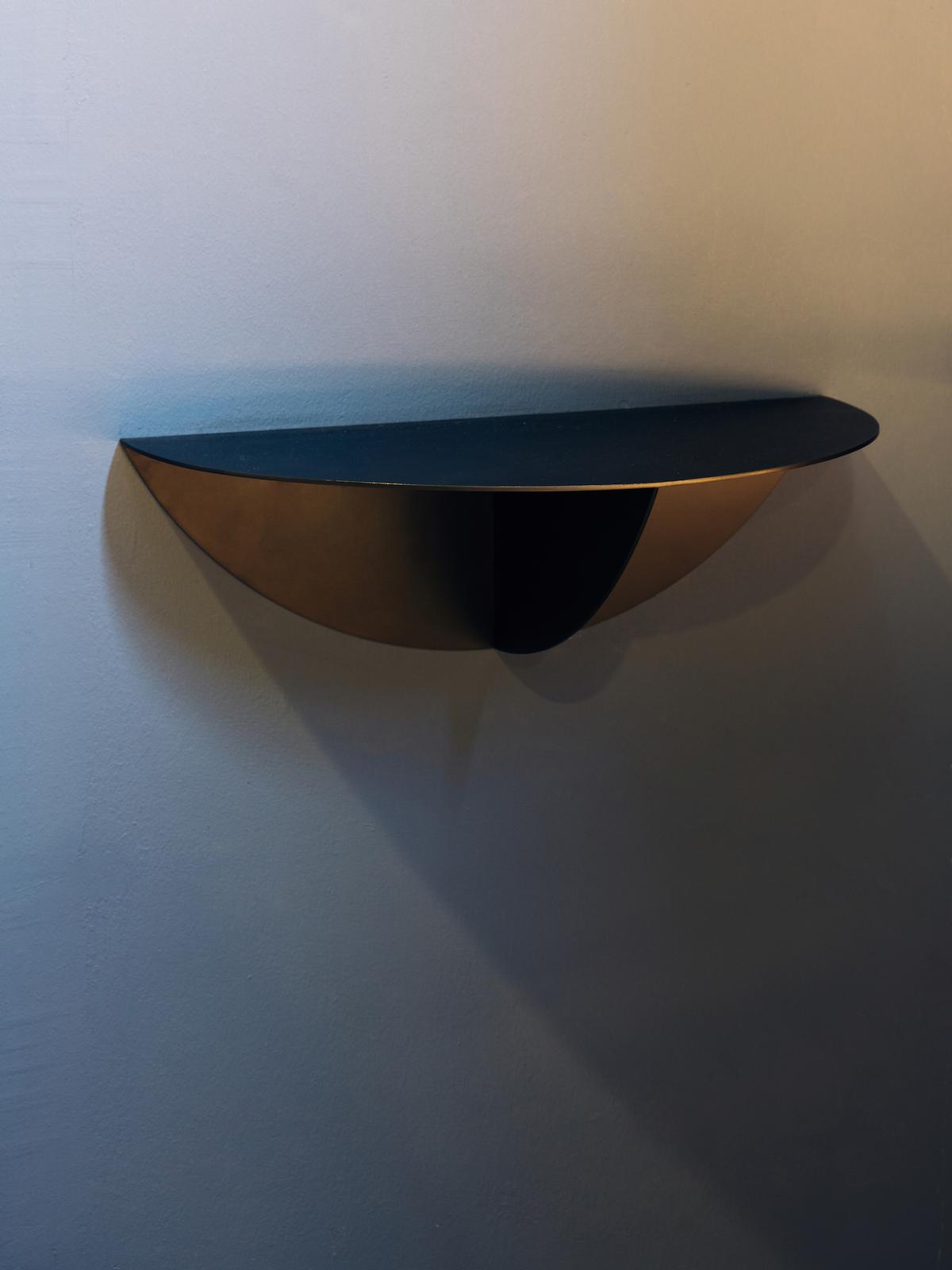 Semicircular metal tables project from the walls / Khoo Guo Jie