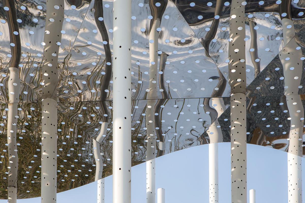 Perforations in the canopies create an interplay of light and shadow as the conditions change and time passes / Aurelien Chen