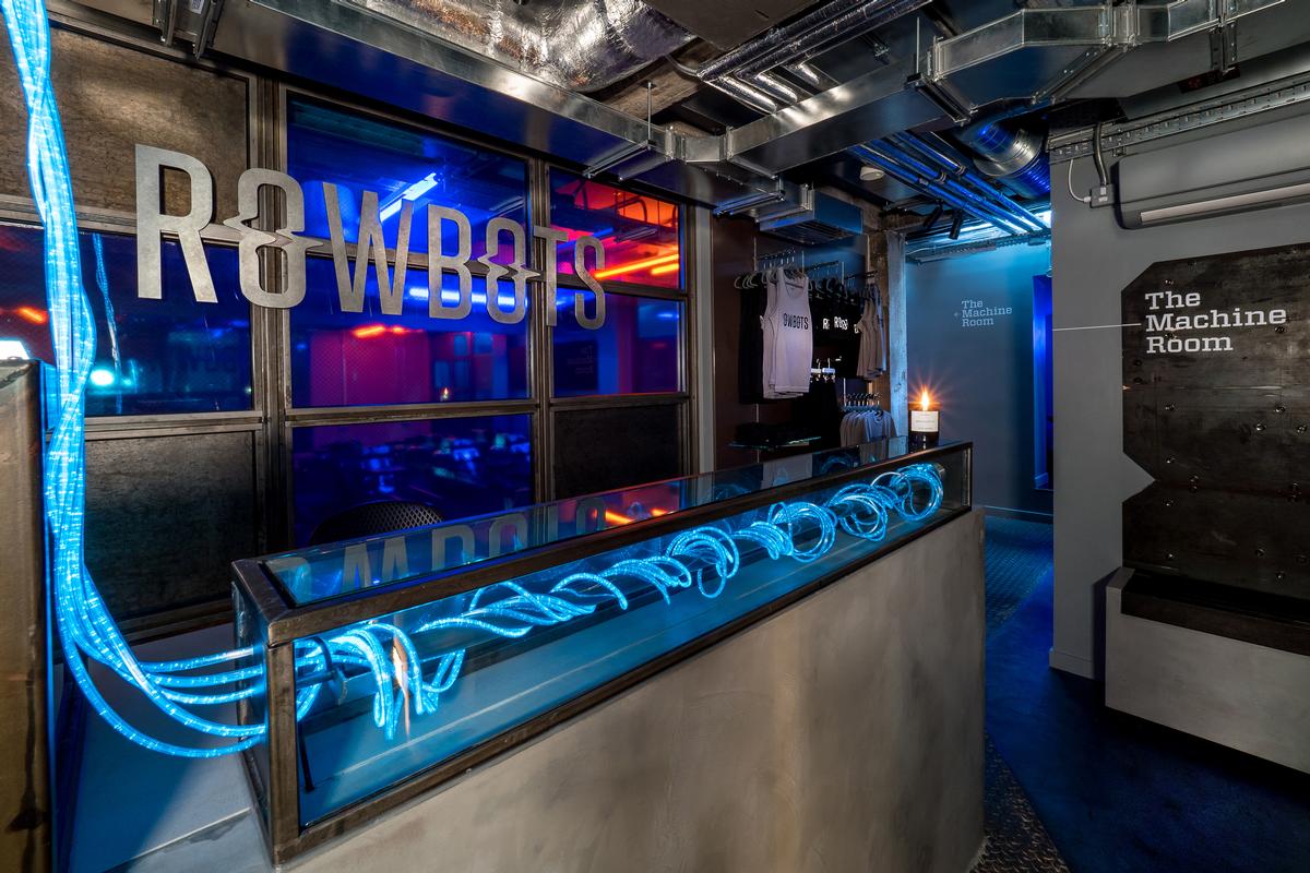 Lighting consultants Nulty complemented the aesthetic with a mix of neon blue and amber strip lights and LED cables in and around the main exercise space / Jim Catlin Photography