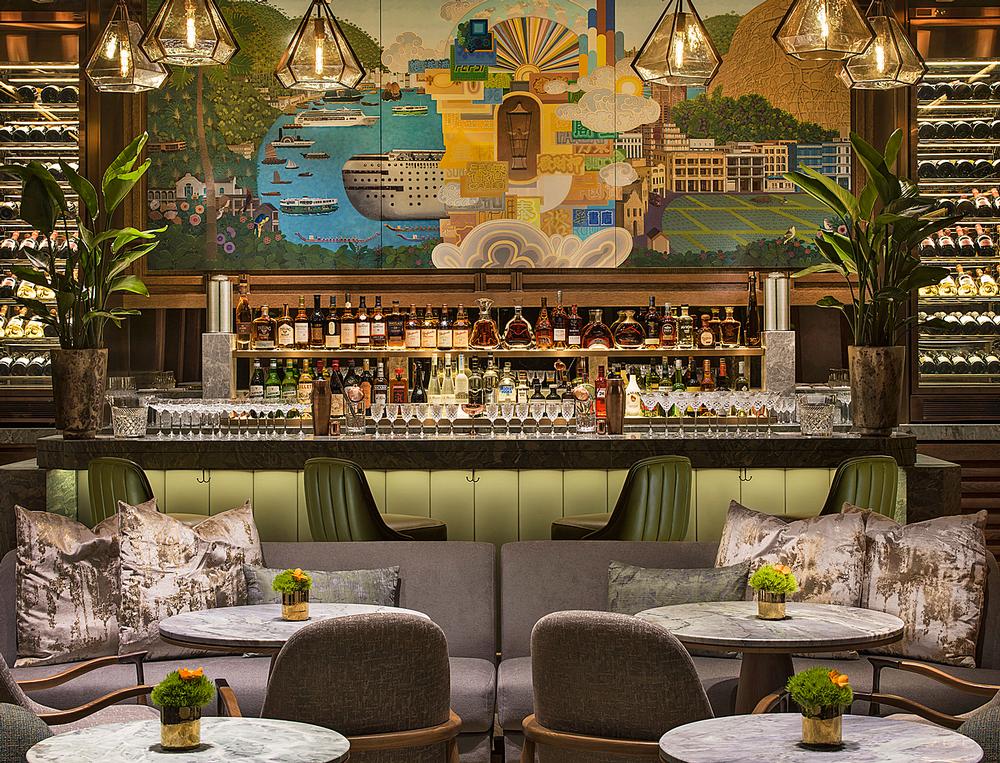 A large mural behind the bar acts as a focal point for the room