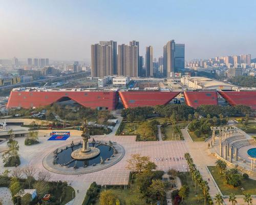 Longgang Cultural Centre is comprised of four angular red buildings, each housing one of its four main elements. / Courtesy of Mecanoo