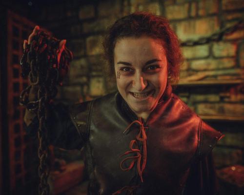 The attraction has an array of rooms, including a court and a torture chamber where characters choose a participant to frighten
