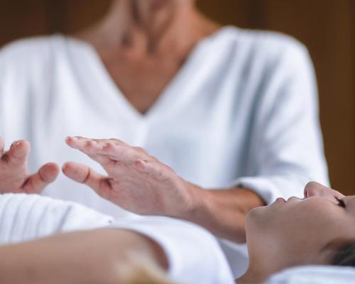One of the topics in the White Paper is how how energy-based therapies, such as Reiki, can add to the bottom line / Shutterstock