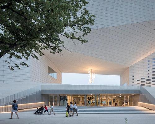 MÉCA’s façade is composed almost entirely of 4,800 prefabricated concrete panels which have been sandblasted with local yellow sand / BIG
