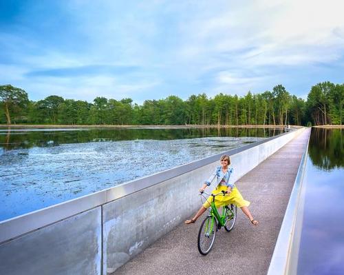 Cycling through Water takes the form of a sunken cycle path run through a lake / VisitLimburg.be